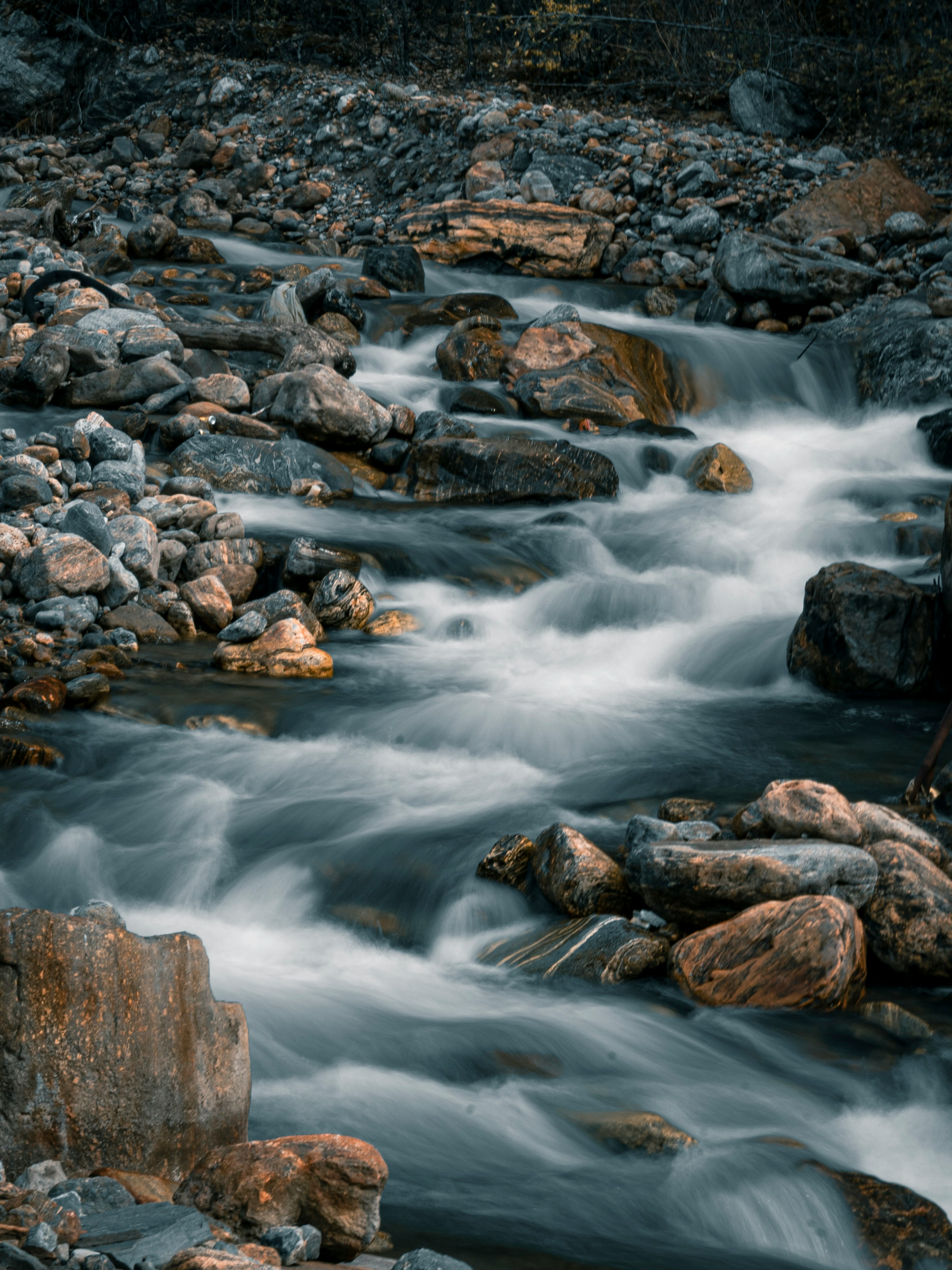 brown rocks on river during daytime